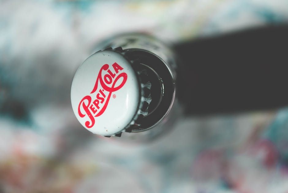Close-up top view of an open Pepsi Cola glass bottle showcasing its iconic branding.